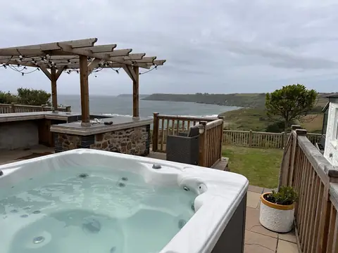 Hot tub on a terrace overlooking the Cornish coast