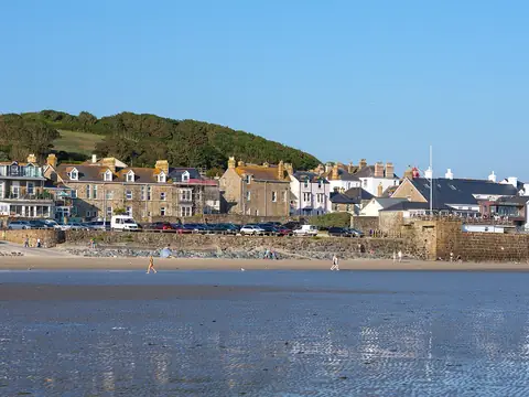 Marazion’s seafront houses seen across the beach at low tide