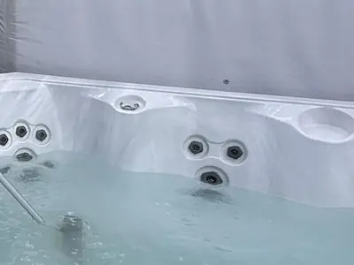 Hot tub being vacuumed out during a clean
