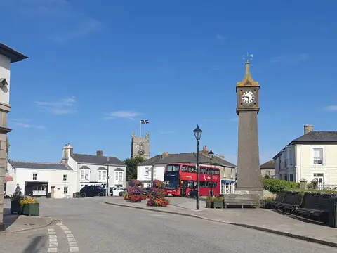 The granite war memorial clock tower in the square at St Just